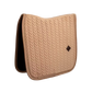 Dressage saddle pad with elegant pearl edging and refined detailing.