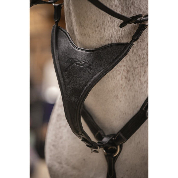 Elastic bib martingale attachment designed to help keep the reins from separating too far apart.