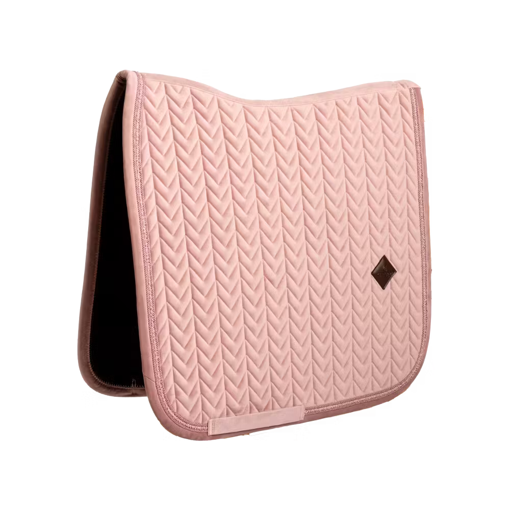 Elegant dressage saddle pad with pearls for a sophisticated competition look.