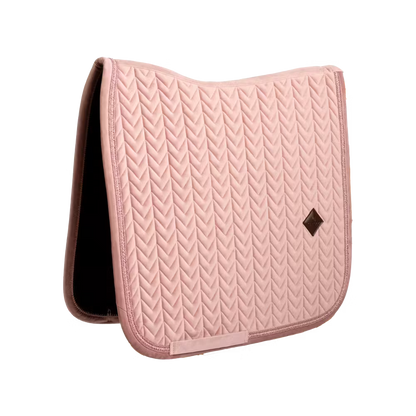 Elegant dressage saddle pad with pearls for a sophisticated competition look.