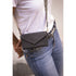Riding phone holder designed to attach conveniently to a belt.
