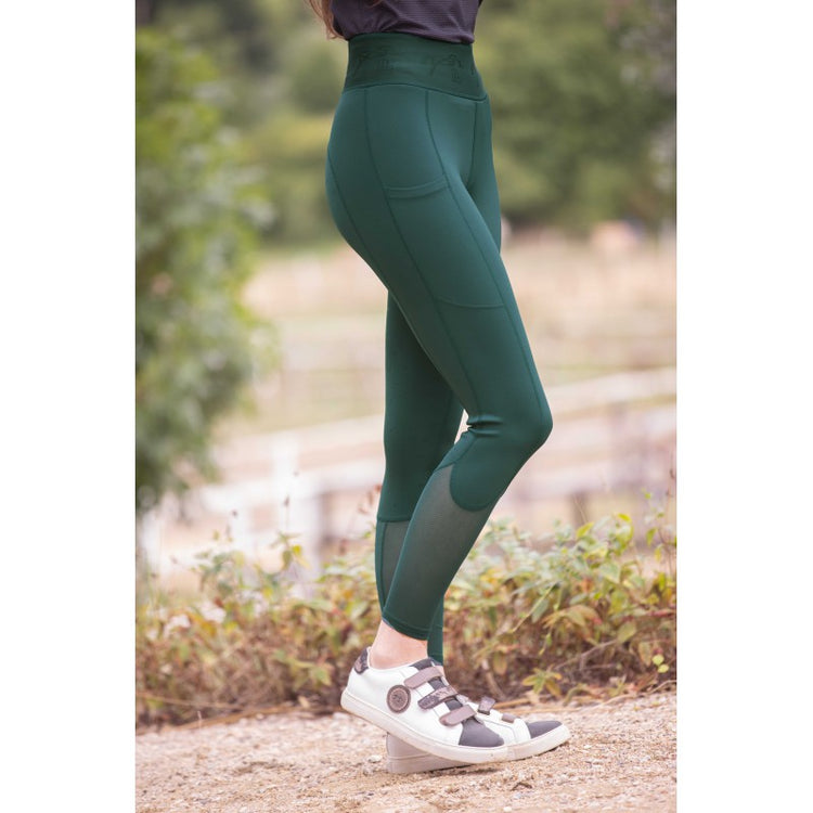 Equestrian leggings with a wide elastic waistband for a comfortable and flattering fit.