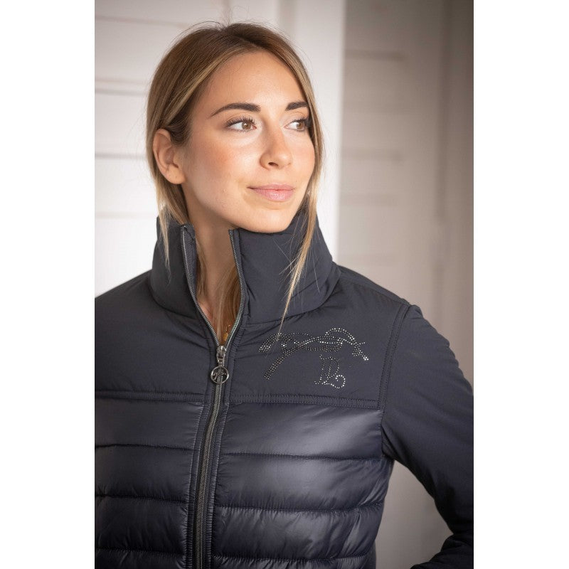 Equestrian quilted jacket with softshell-style sleeves and polyester padding.
