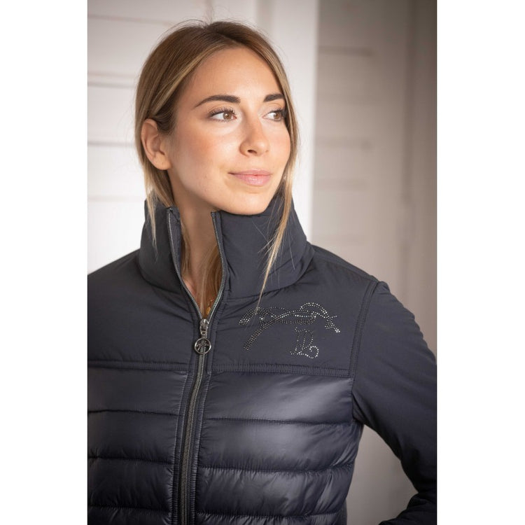 Equestrian quilted jacket with softshell-style sleeves and polyester padding.