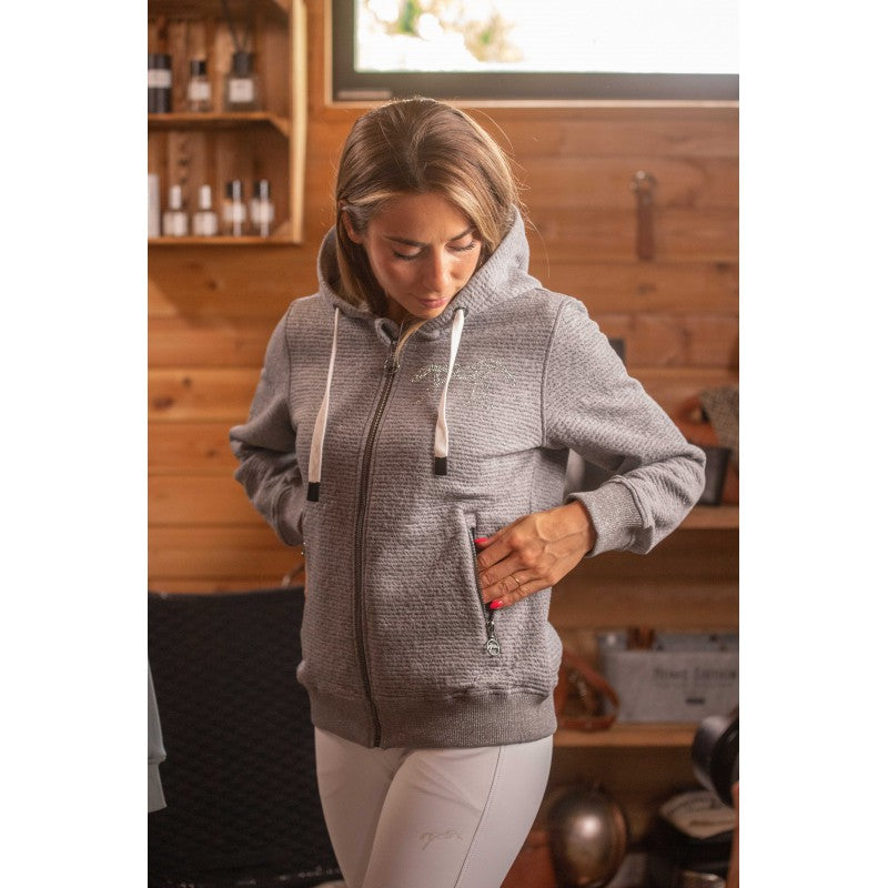 Equestrian zip sweat jacket for women with practical front pockets and a large hood.
