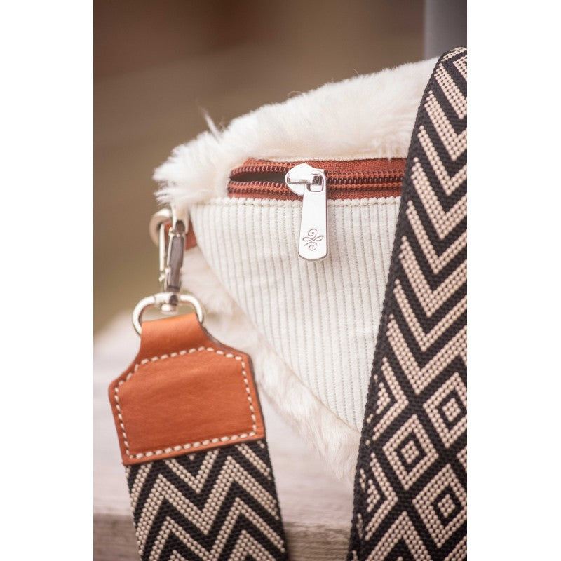 Faux fur and corduroy crossbody bag with wide adjustable strap and contrasting cognac zip.