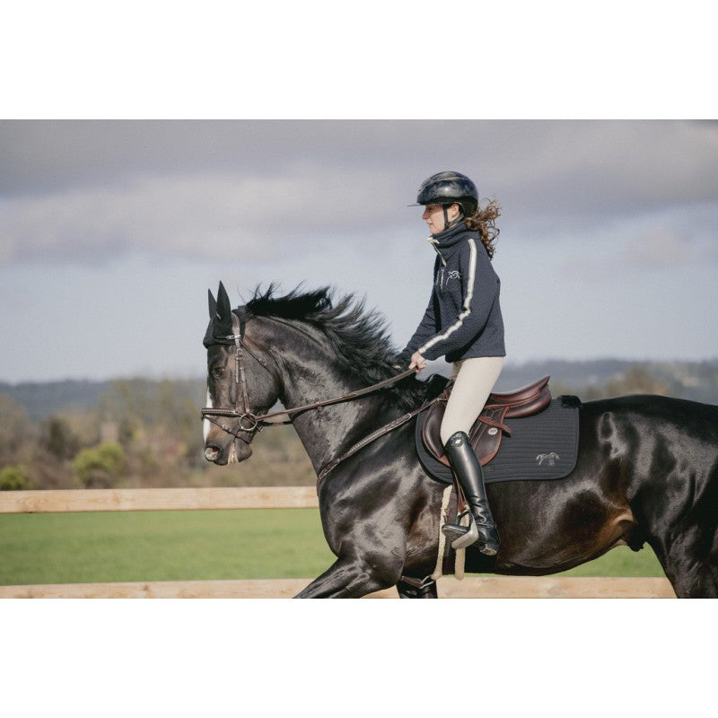 Faux fur saddle pad for sensitive horses with soft material around the saddle and withers.