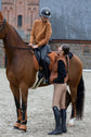 Horse rider sitting on horse in Kingsland Winter clothing with lady on the ground also wearing Kingsland clothing