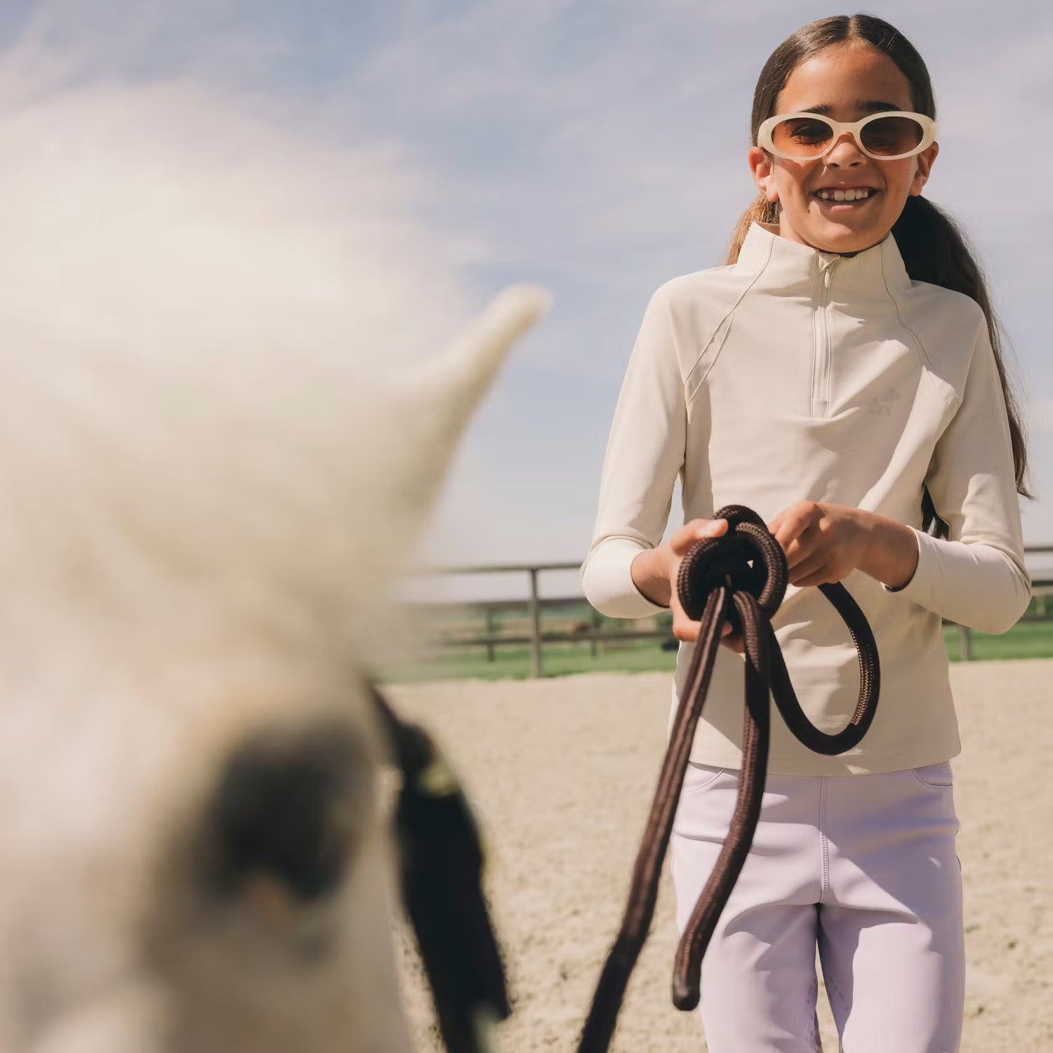 Girls stretch training shirt for riding with unrestricted freedom of movement.
