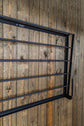 Space-saving horse rug rack with foldable wall design