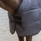 Horse rug liner for winter with a soft and cozy interior.