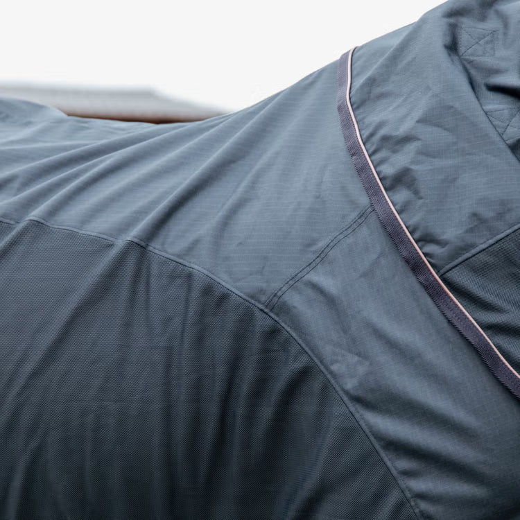 Breathable combo fly rug for comfortable turnout in changing temperatures.