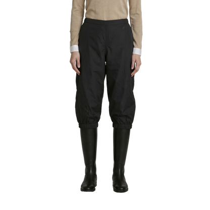 Rain cover extending just over the knee to preserve direct lower-leg contact with the horse