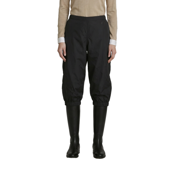 Rain cover extending just over the knee to preserve direct lower-leg contact with the horse