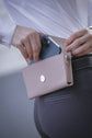 Leather belt phone pouch for riding with secure loops for convenient hands-free storage.