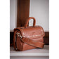 Leather mini bag with decorative metal studs and zip closure