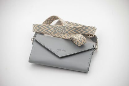 Leather phone bag for riding designed to keep a mobile phone conveniently within reach.