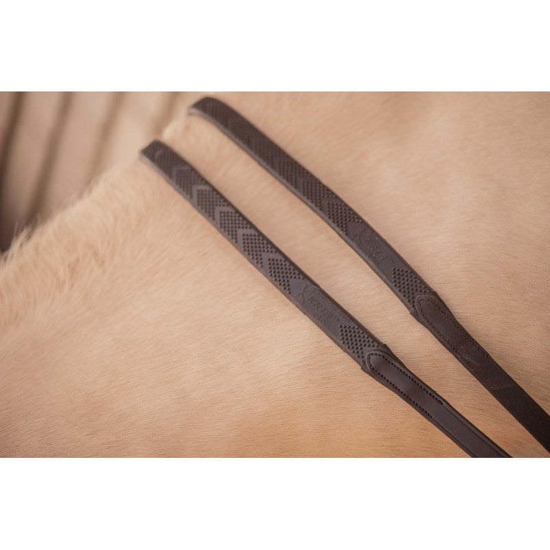 Leather reins with rubber grip sections for a secure and comfortable hold in the saddle.