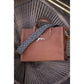 Leather tote bag for women with handles for carrying by hand or on the arm.