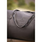 Leather travel bag for women with practical handles and shoulder strap.
