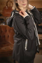 Lightweight equestrian rain jacket with breathable and waterproof construction.