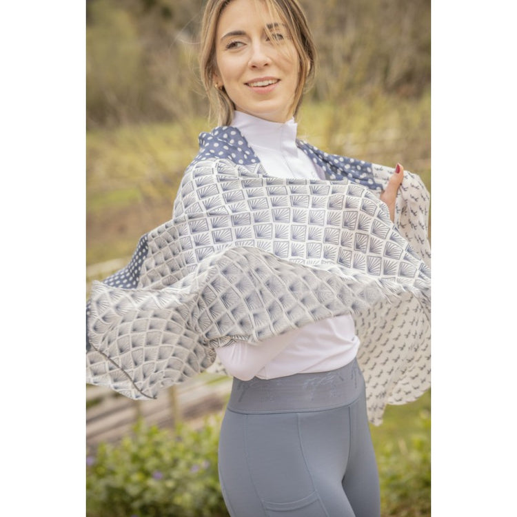 Lightweight scarf for women designed for wearing around the neck or as a fashion accessory.