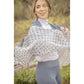 Lightweight scarf for women designed for wearing around the neck or as a fashion accessory.