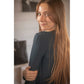 Long-sleeve sports top with woven chevron pattern and shoulder gathers