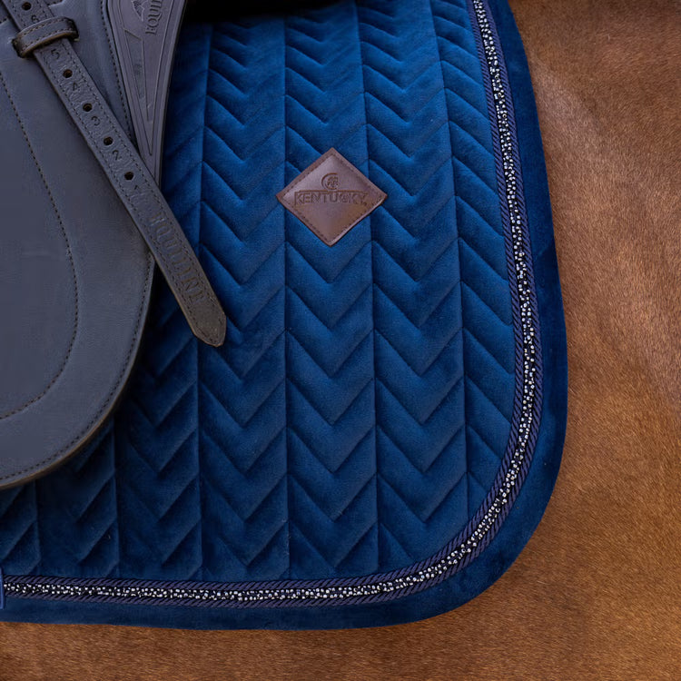 Luxury dressage saddle pad with velvet fabric and elegant mini pearl detailing.