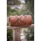 Medium leather travel bag with detachable long shoulder strap.