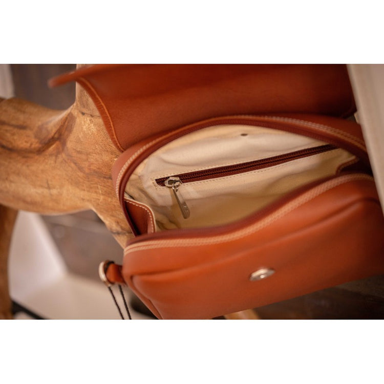 Miniature leather handbag with elegant rounded design