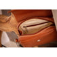 Miniature leather handbag with elegant rounded design