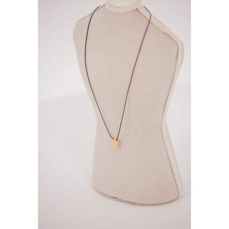Penelope Adelya Necklace with signature horse logo on a delicate round pendant