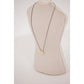 Penelope Adelya Necklace with signature horse logo on a delicate round pendant