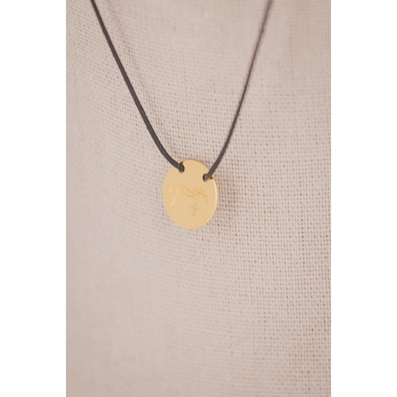 Penelope Adelya pendant necklace with a small round horse logo detail.