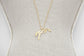 Penelope Angele gold horse pendant necklace with a discreet feminine look.