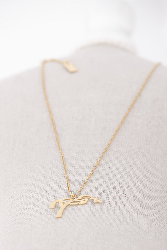 Penelope Angele Gold Necklace with delicate chain and signature horse logo pendant