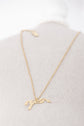 Penelope Angele Gold Necklace with delicate chain and signature horse logo pendant