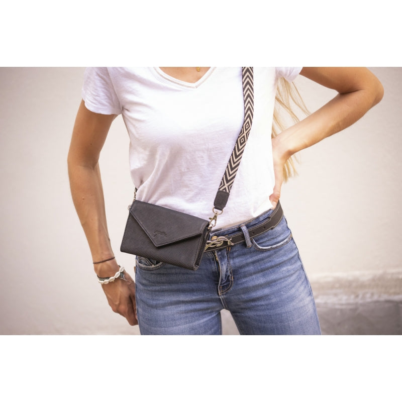 Penelope belt phone pocket for convenient access while riding.