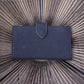 Penelope Bertille leather purse with practical snap button closure.