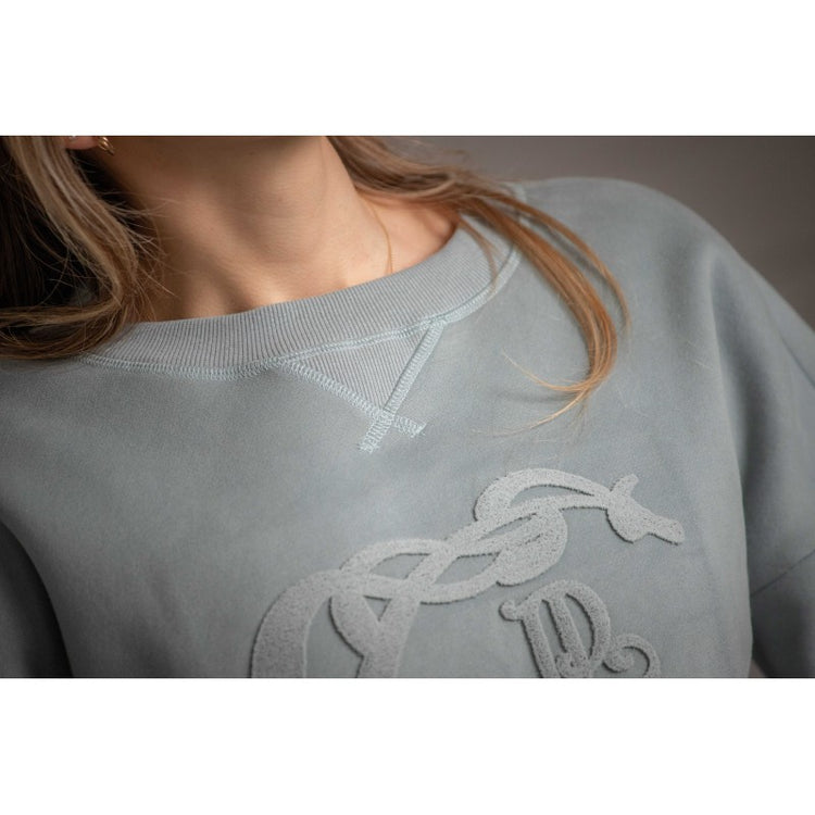 Penelope Bianca sweatshirt with subtle tone-on-tone embossed logo across the front.