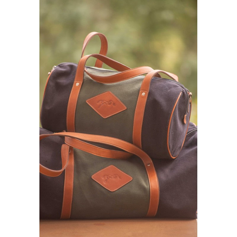 Penelope Bowling Bag Canvas with classic rounded shape, leather handles and elegant tricolour design.