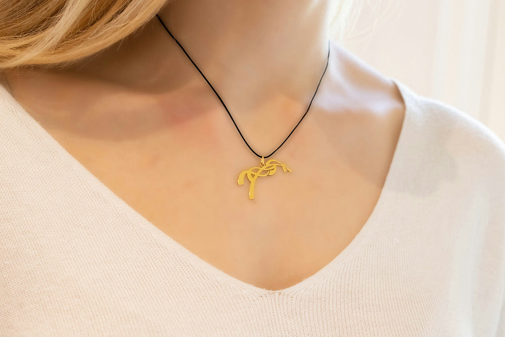 Penelope Equestrian Necklace with a gold-plated horse pendant.