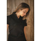 Penelope Iliana equestrian polo with sophisticated short sleeve design.