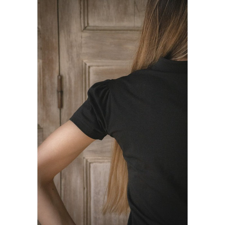 Penelope Iliana V-neck polo with a modern equestrian-inspired look.