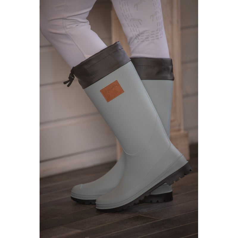 Penelope Jessica waterproof boots in Light Green with black drawstring cuff, lugged sole and logo details.