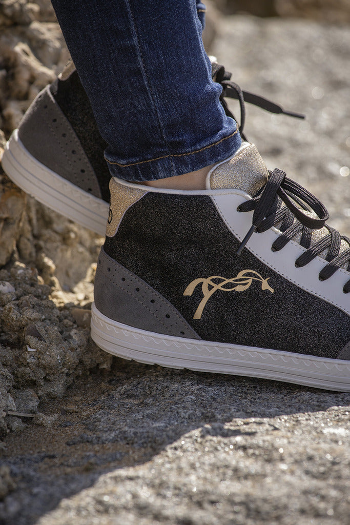 Penelope Jupiter glitter sneakers with black, gold and grey tri-color styling.