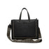 Penelope leather bag with wide adjustable herringbone patterned shoulder strap.