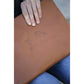 Penelope leather computer case with embossed branding and zip closure.
