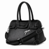 Penelope Maelys bag with decorative silver charm on the front.